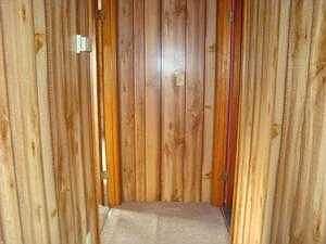 hallway shows newer carpeting and paneling
