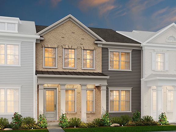 Savannah Exterior 2 features Brick, Hardi Board siding, covered front porch and rear 2 car garage