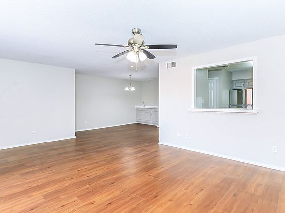 huge spacouse living dinning area including a sink buffet area