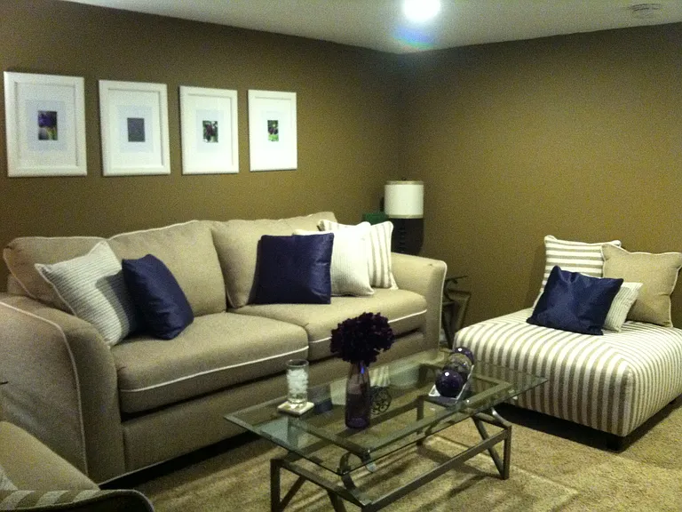 Family room, that has a tv & entertainment center.