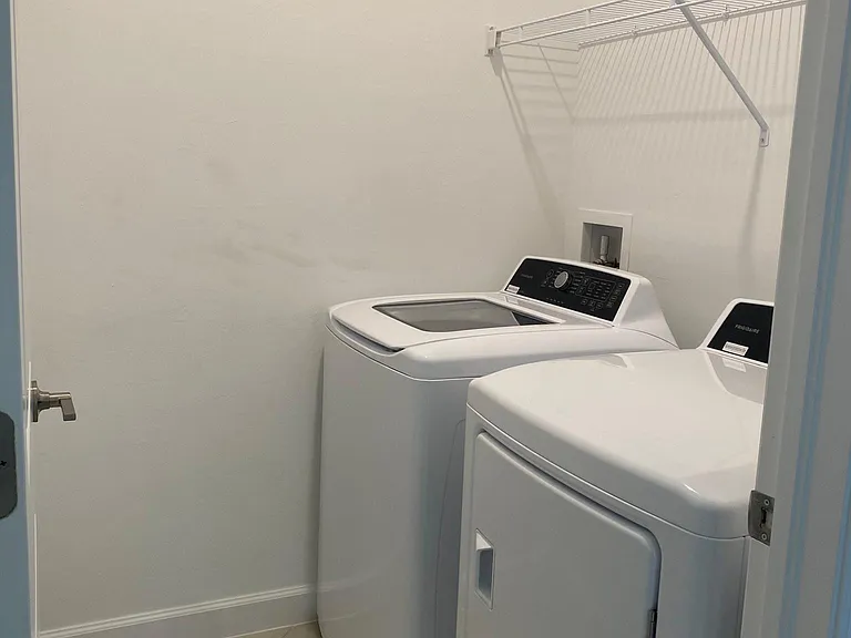 Laundry room with full size washer and dryer