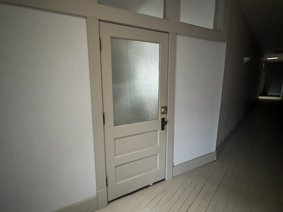 Apartment entry. Stairs down to ground level at front and back of building.