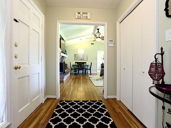 Foyer area, note the beautiful hardwood floors. Convenient guest coat closet.