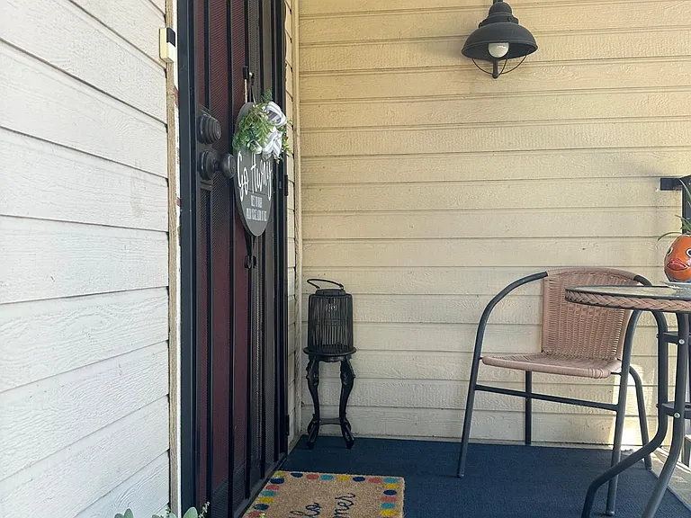 condo front door with lockable steel screen door