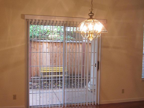 Dinning area attached to living area, with sliding door to outside covered patio