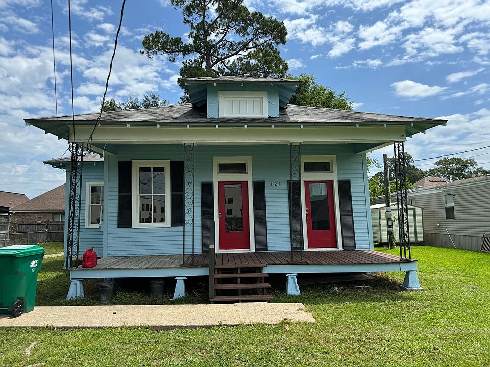 Fresh paint, New Orleans feel, front and side covered porches, quiet neighborhood on dead end street near great school.