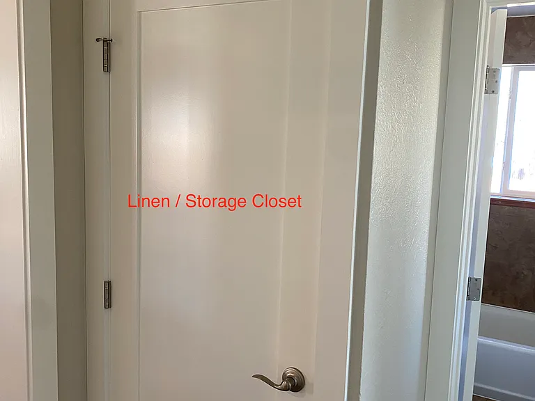Hall Linen/Storage closet between the kitchen and bathroom