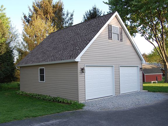 Large 2 Car Garage with area above.