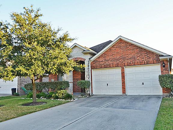 The stone entry way adds great curb appeal to the beautiful one story home.
