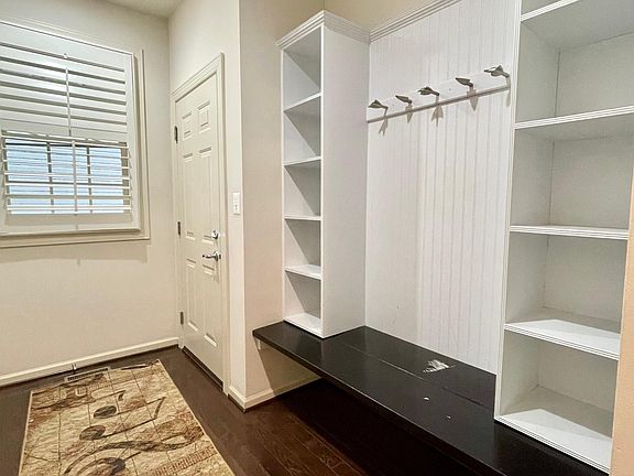 mud room passage from the garage. custom Builtins to keep things organized for the whole family. it has full size coat closet next to it