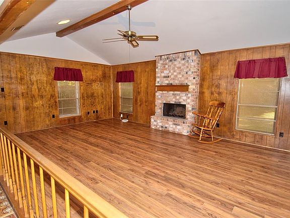 This large family room offers gas log fireplace for those cool, winter evenings.