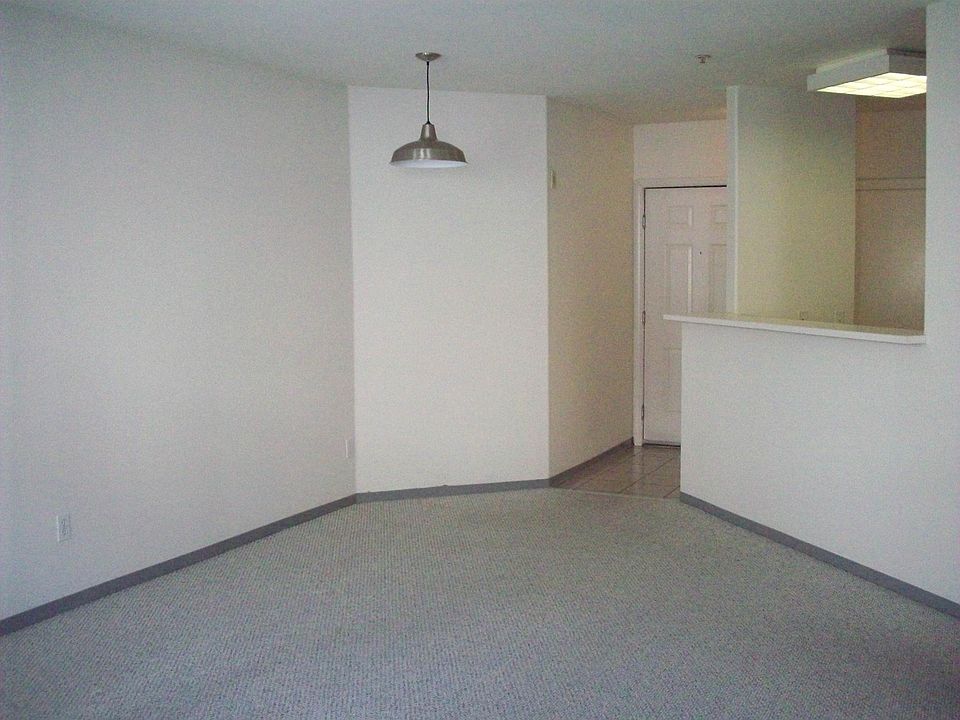 View of entry and kitchen from living room.
