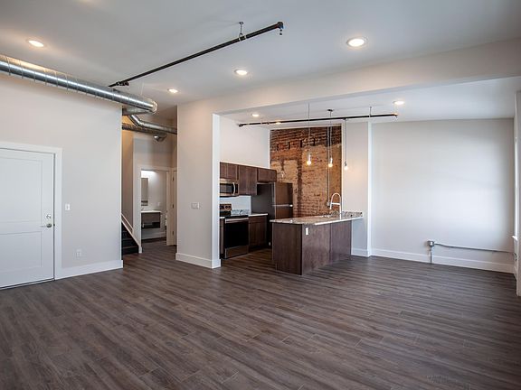 Hallway separates the bedroom from living space.