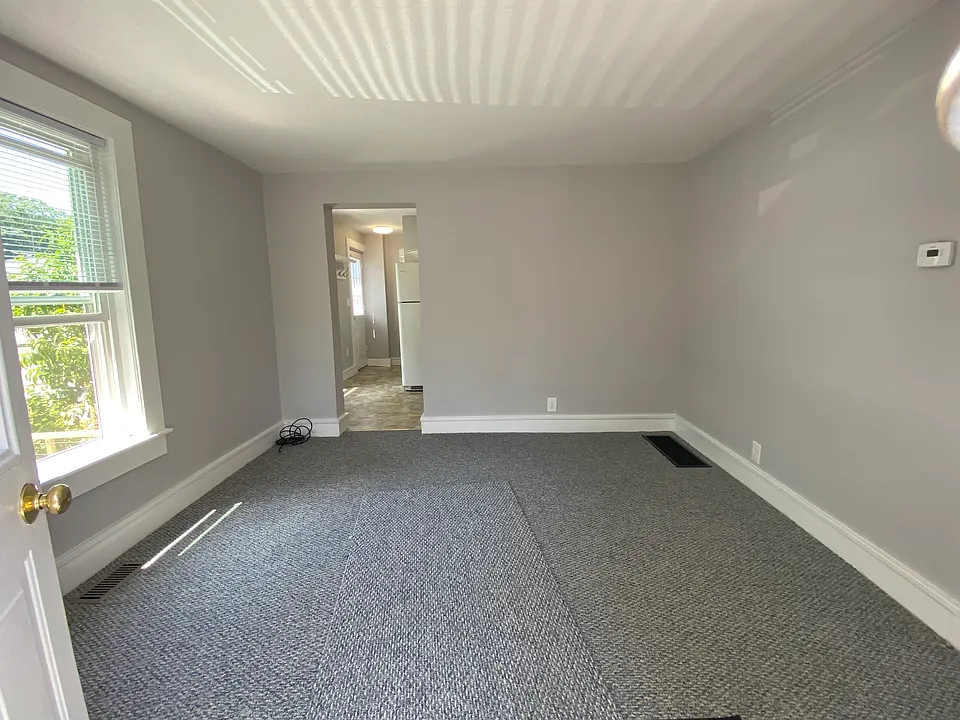 Living room facing towards kitchen.