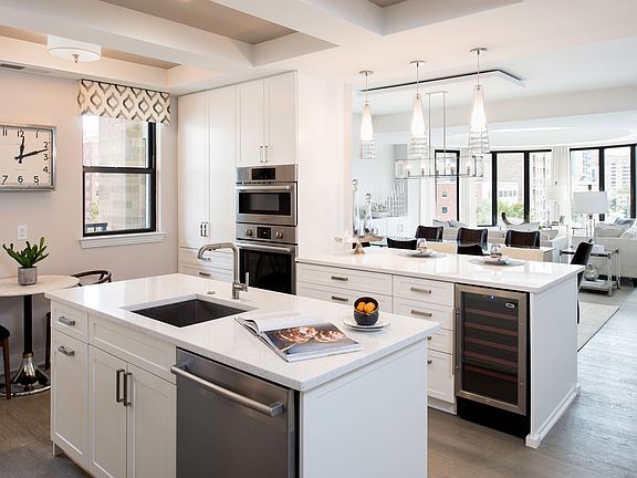 The fully equipped kitchen blends modern style and functional flow to create an exceptional space.