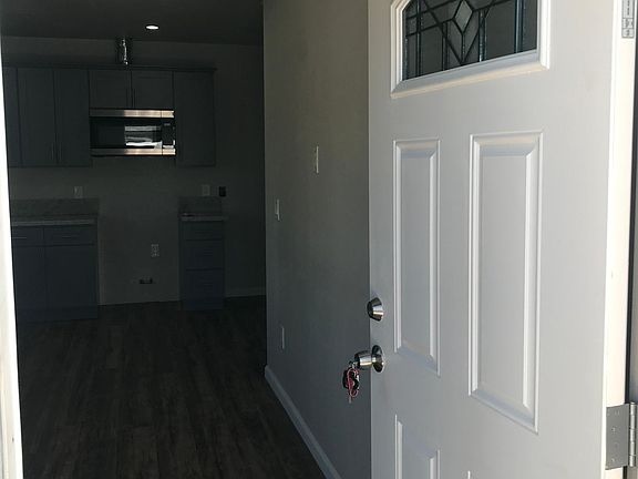 This is the entrance. small living room that accommodates a small sofa.