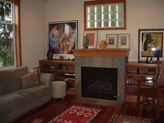 Living room, with custom mantel, hearth, bookcases