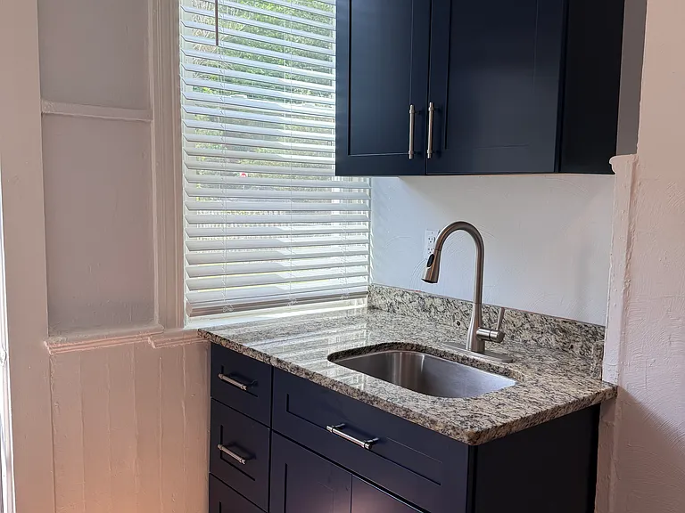 New cabinets, real granite countertops, pull-down sprayer faucet