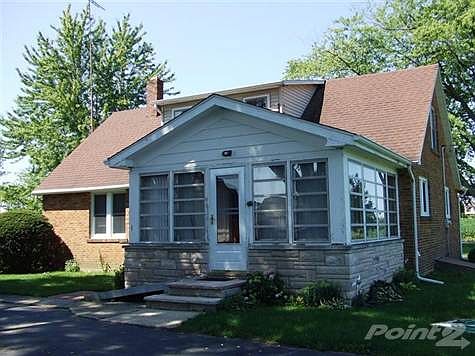 Rear of home with four-season room