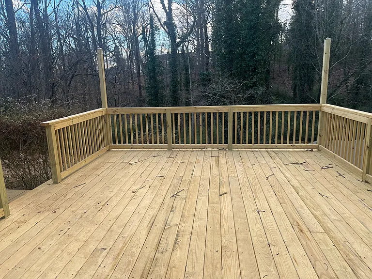 outside deck with light posts for sting lights