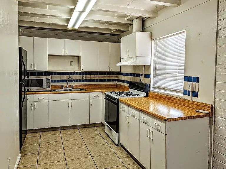 Spacious kitchen with generous cabinet space, amazing lighting