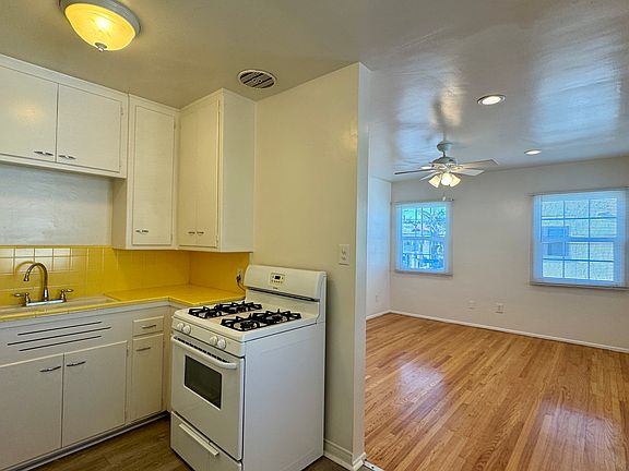 A photo from the eat-in kitchen towards the front door and living room.