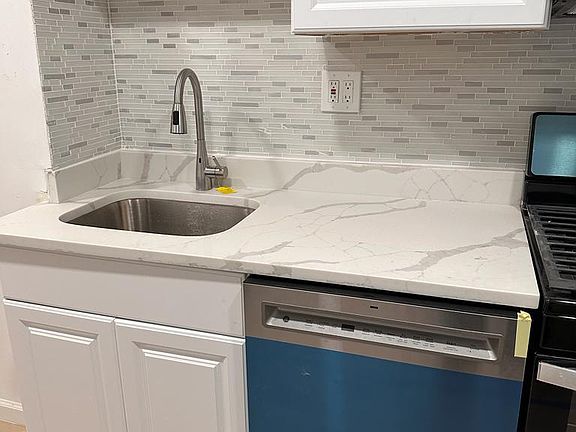 Marble kitchen countertop , new dishwasher