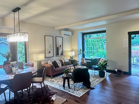 The main floor has high ceilings, large windows and open living spaces.