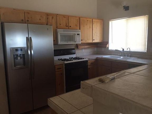 Kitchen with matching hickory cabinets thru out the house