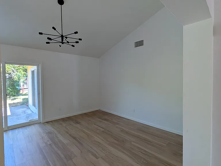 Dining room with sliding glass doors to the back patio.