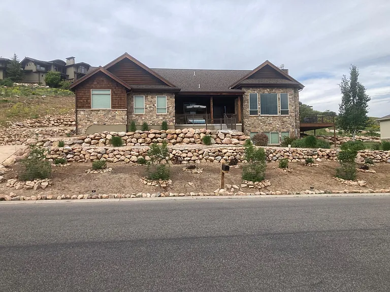 Spacious living room in a beautiful open-floor-plan home. Enjoy unobstructed mountain views, vibrant wildlife from your couch, and peace of mind with security cameras. Zero-scape yard ensures low maintenance and natural beauty year-round.