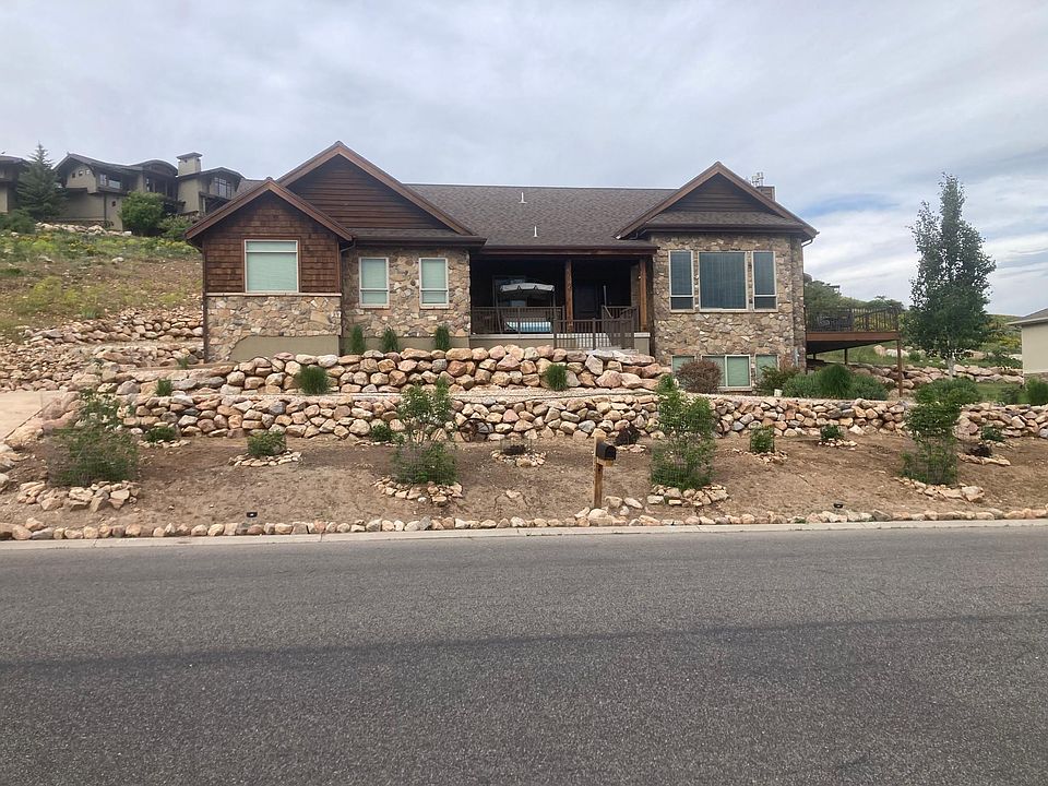 Spacious living room in a beautiful open-floor-plan home. Enjoy unobstructed mountain views, vibrant wildlife from your couch, and peace of mind with security cameras. Zero-scape yard ensures low maintenance and natural beauty year-round.