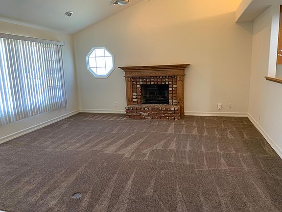 Living Room with High Vaulted Ceiling & Fireplace