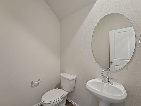 The first-floor powder bathroom is convenient for guests.