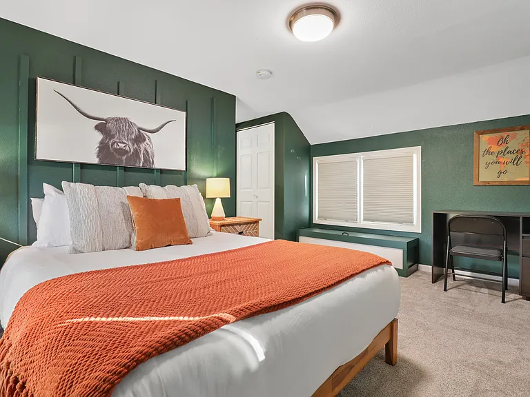 Queen bed, 40" smart TV, dedicated workspace, closet storage, black out blinds.