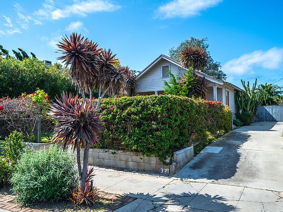 Long driveway with additional parking behind the gate