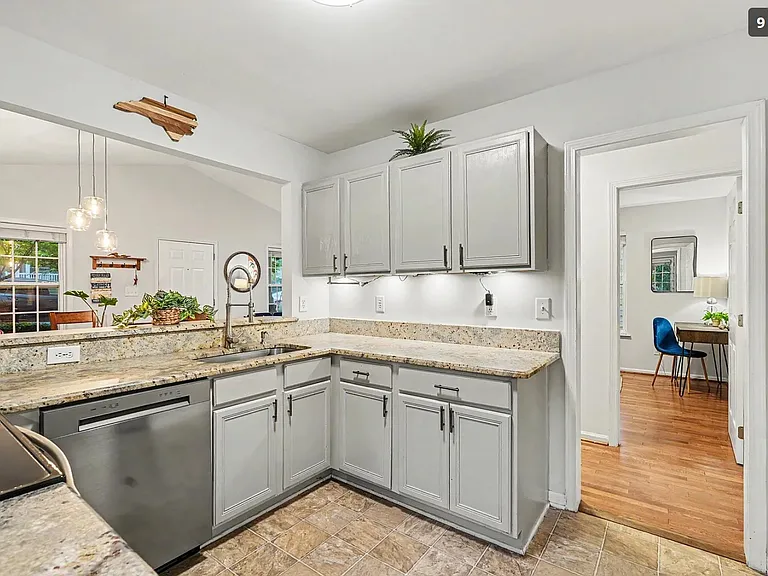 Stainless Refrigerator is located on the left wall as you enter the kitchen.