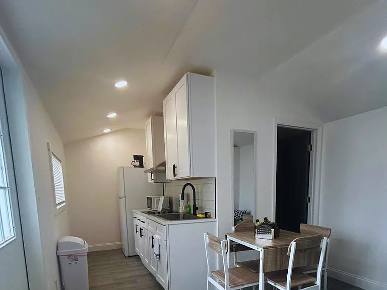Kitchen and dining area conveniently located together for added comfort.