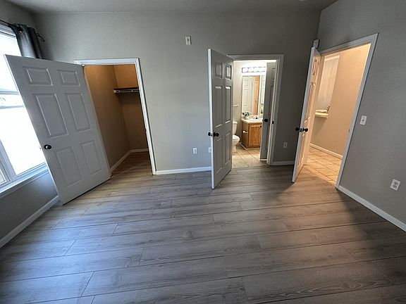 Second bedroom with walk in closet and access to bathroom.