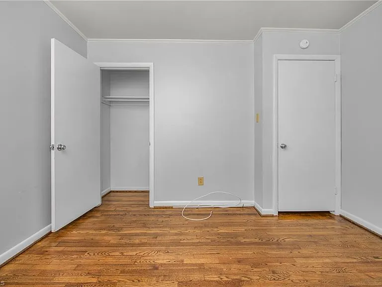 Bedroom 2 - closet and door to hallway