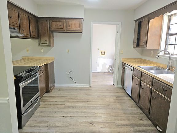 Kitchen into laundry room. View from dining room