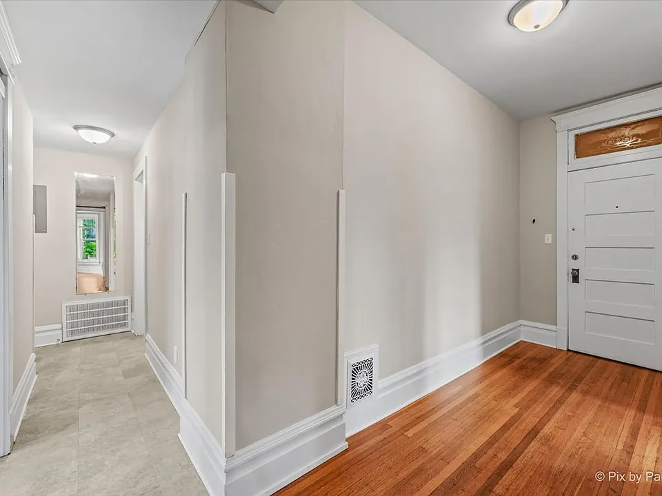 Front door and hallway to laundry and bathroom