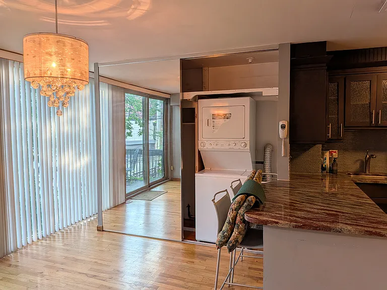 closet in eat in kitchen with washer/dryer