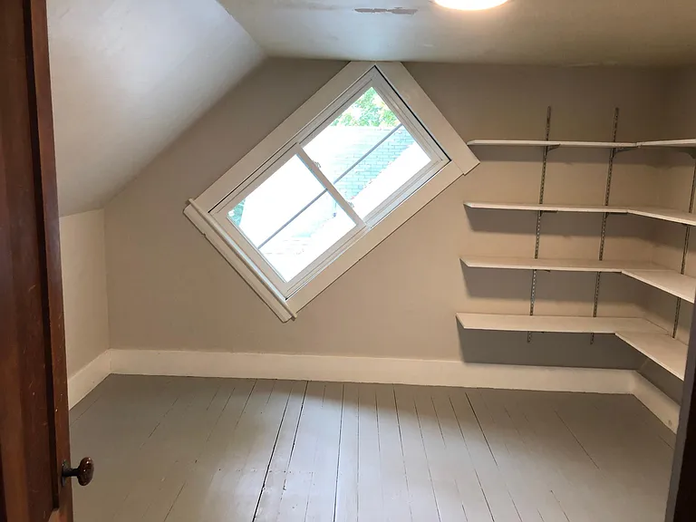 Third floor room that could be used as office or bedroom. This room has a heat pump for AC and heating.