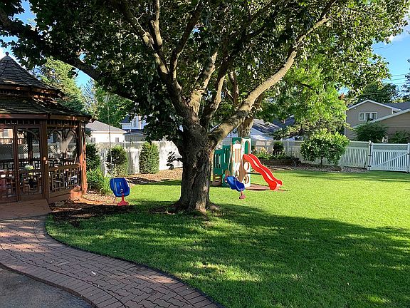 Backyard w/ screen gazebo.