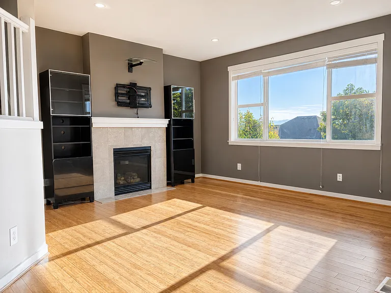 Sun-drenched living room, with great mountain views, built-in surround-sound speakers and full-motion TV wall-mount ready to use.