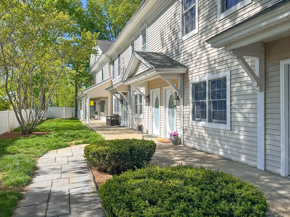 Sun-drenched front patio welcomes you home. Access to elevator to garage