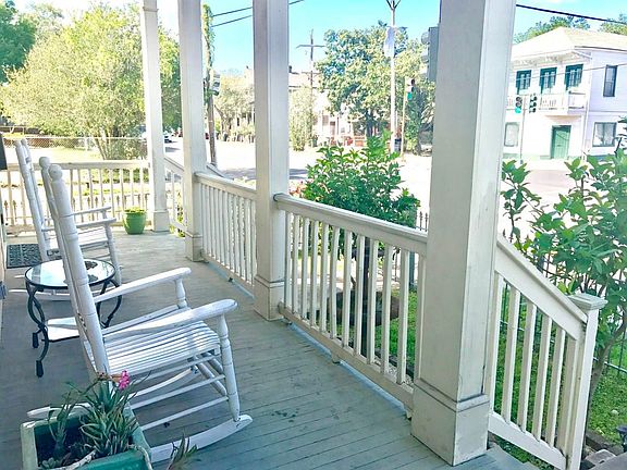 Porch Overlooking Gated Front Yard