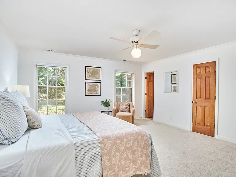 Large Primary Suite with two closets and large windows.