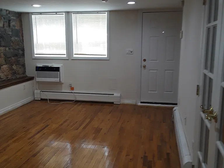 Bedroom entrance on right with french doors